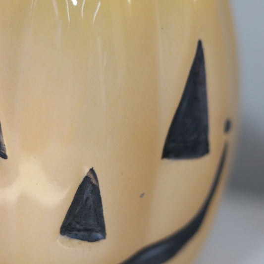 evil pumpkin mug in yellow