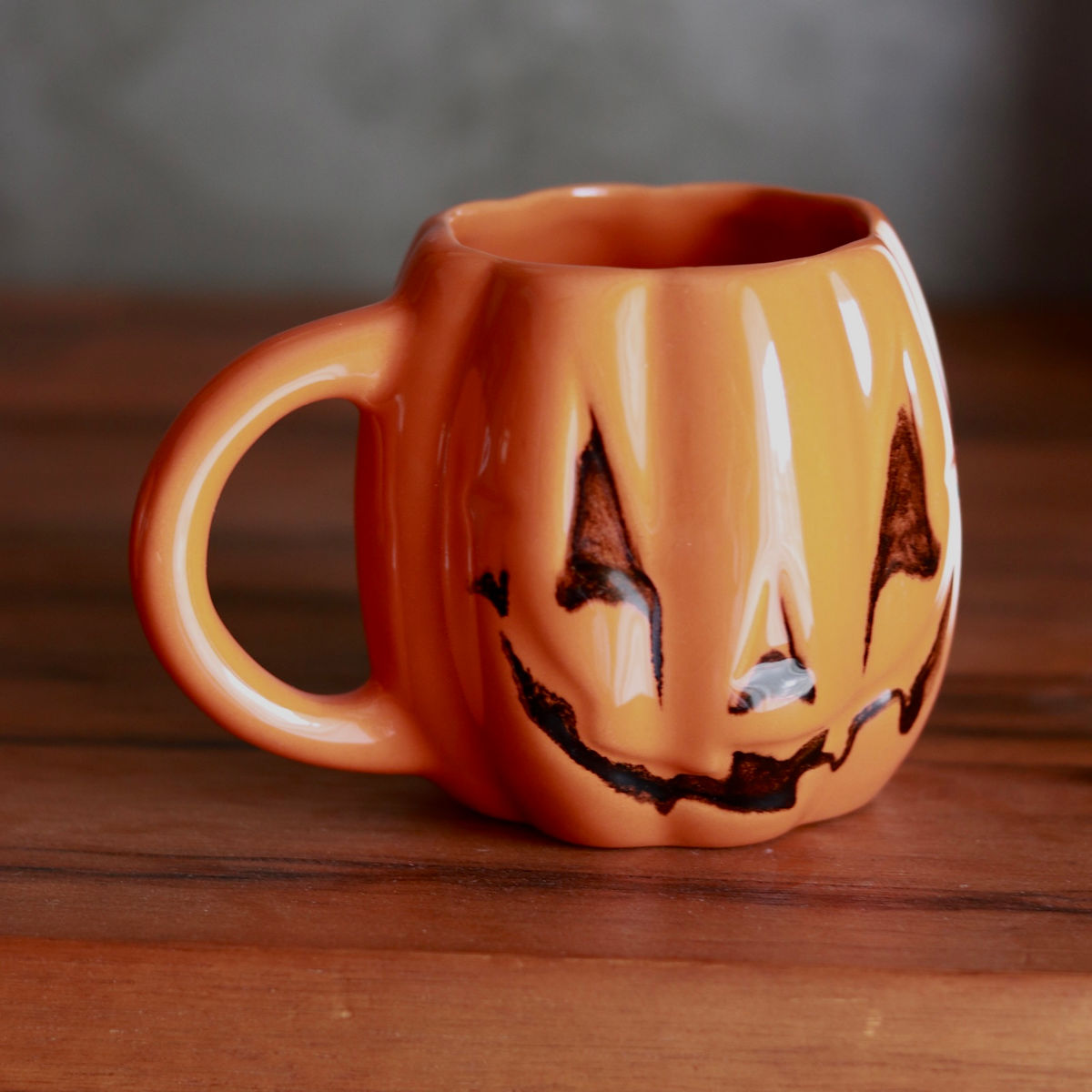 evil pumpkin mug in orange