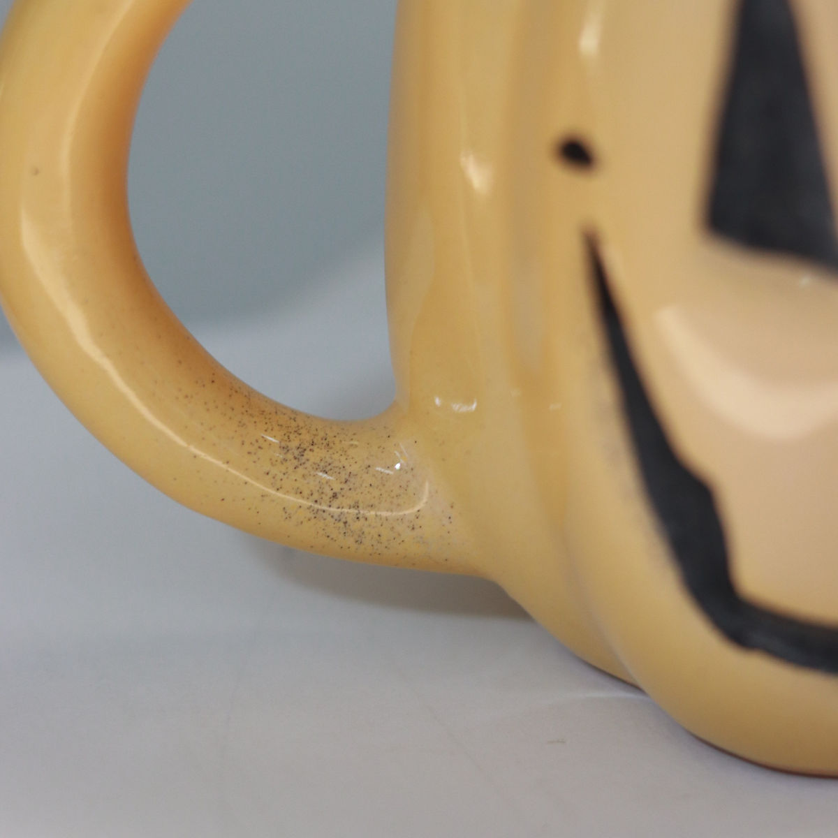 evil pumpkin mug in yellow