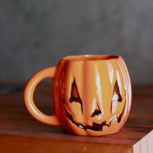 evil pumpkin mug in orange