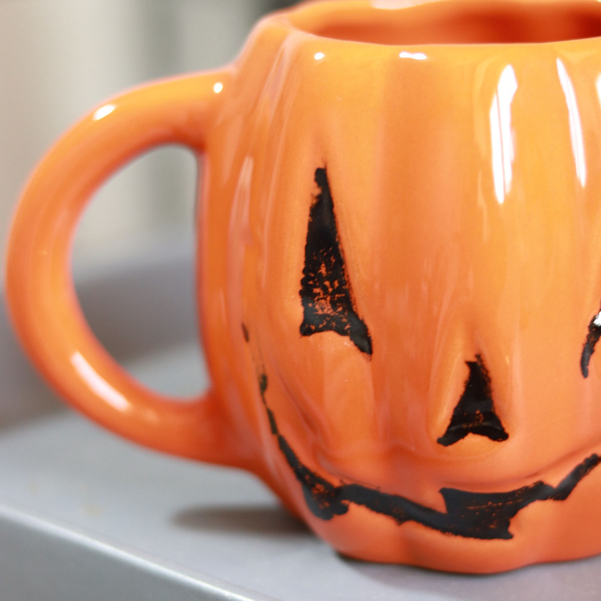 evil pumpkin mug in orange