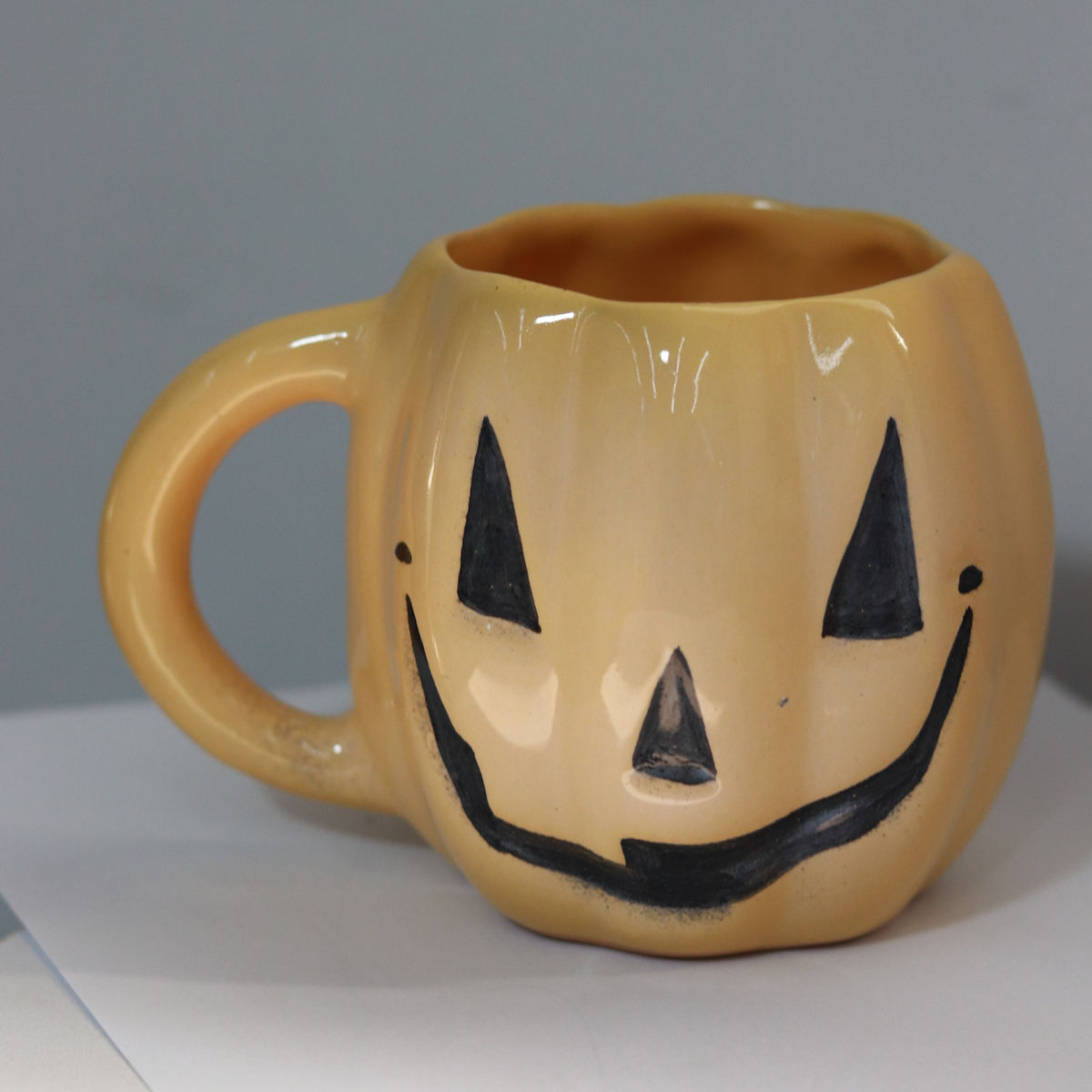 evil pumpkin mug in yellow