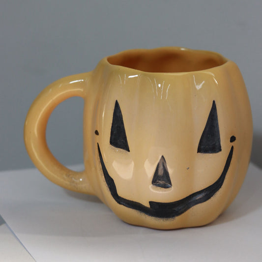 evil pumpkin mug in yellow