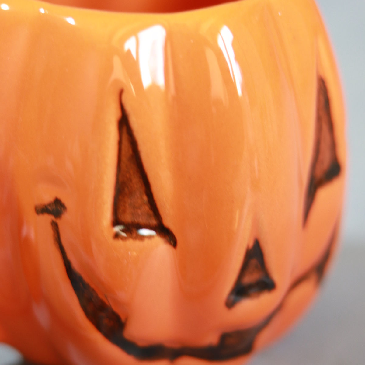 evil pumpkin mug in orange