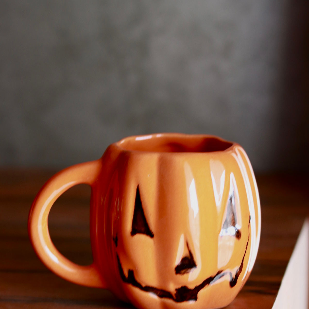 evil pumpkin mug in orange
